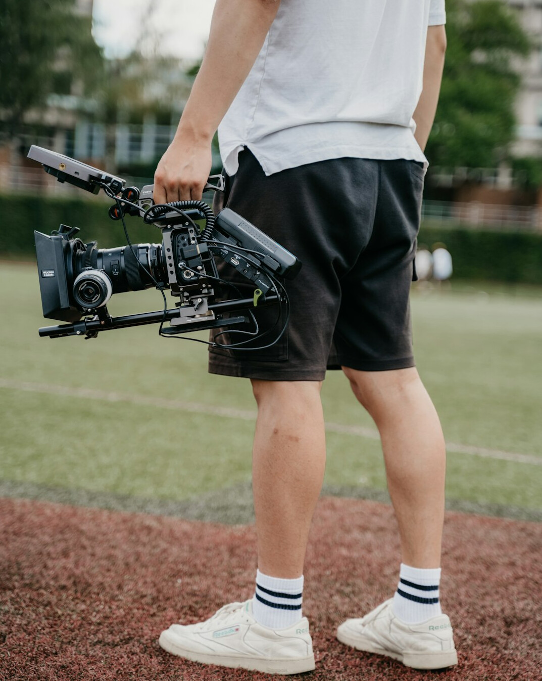Camera operator filming inside a television studio